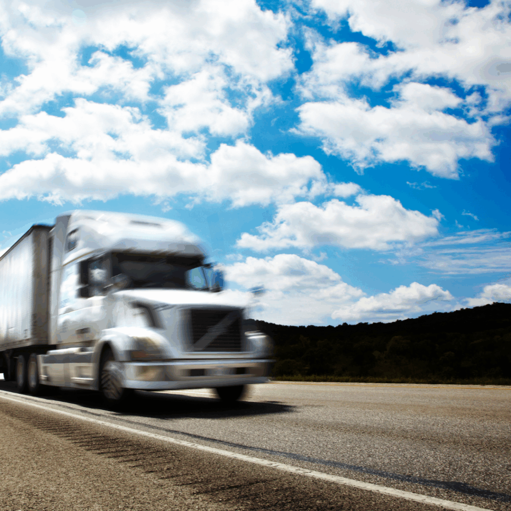 White food logistics truck driving