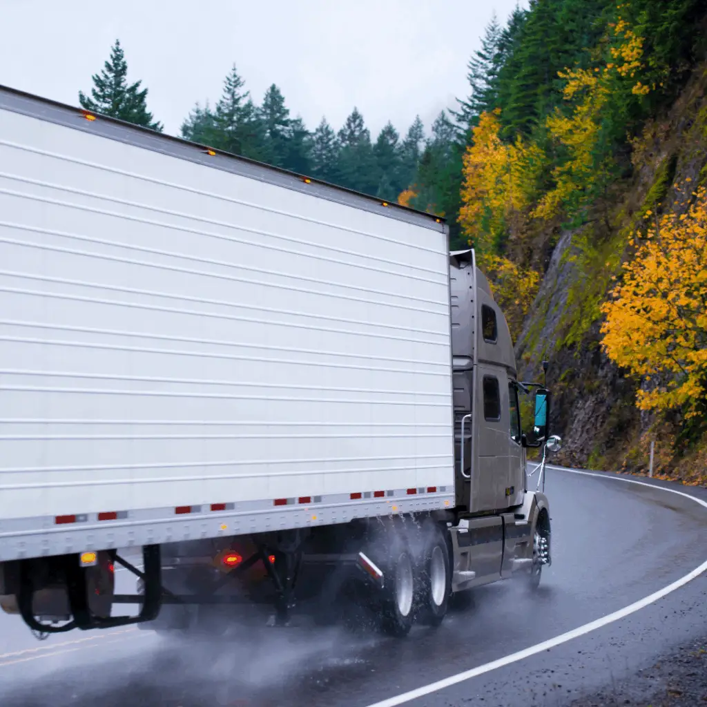 Balancing Spot Rate and Savings Image Header showing truck turning around bend.