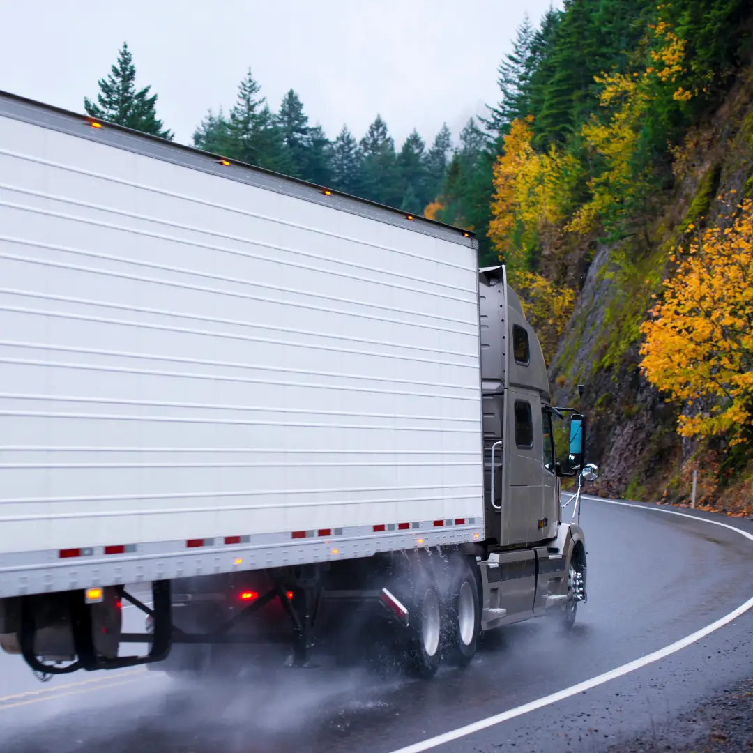 Balancing Spot Rate and Savings Image Header showing truck turning around bend.